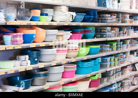 Plastic Chinese dishes on shop`s shelves Stock Photo